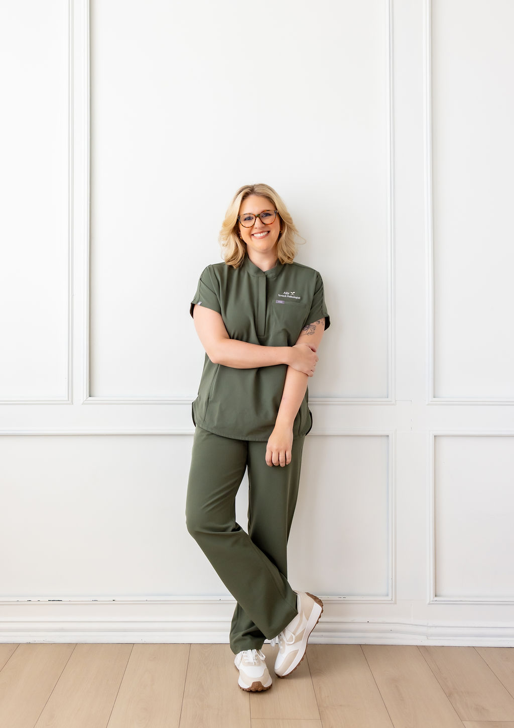 Portrait of Ally Gore in green scrubs